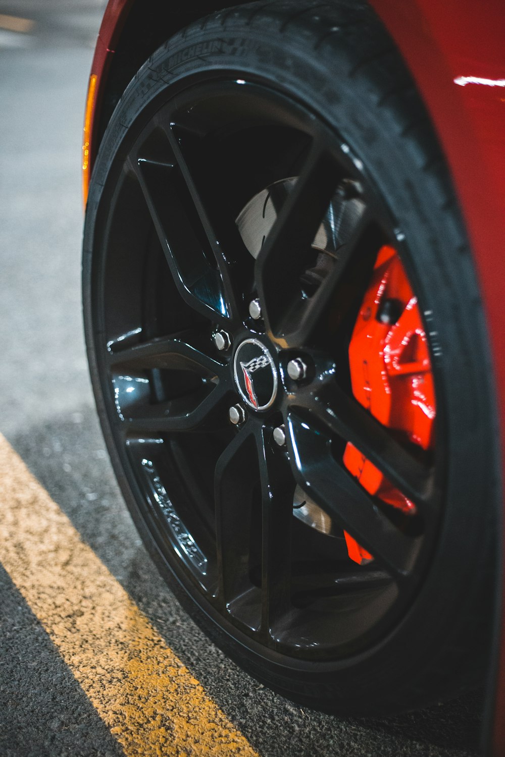 black and red wheel on brown concrete floor