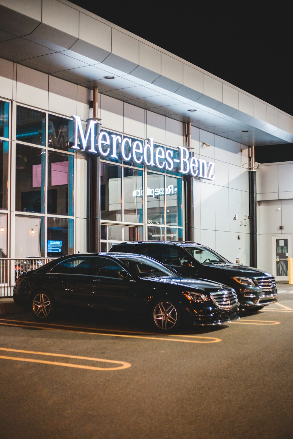 black sedan parked in front of UNKs store