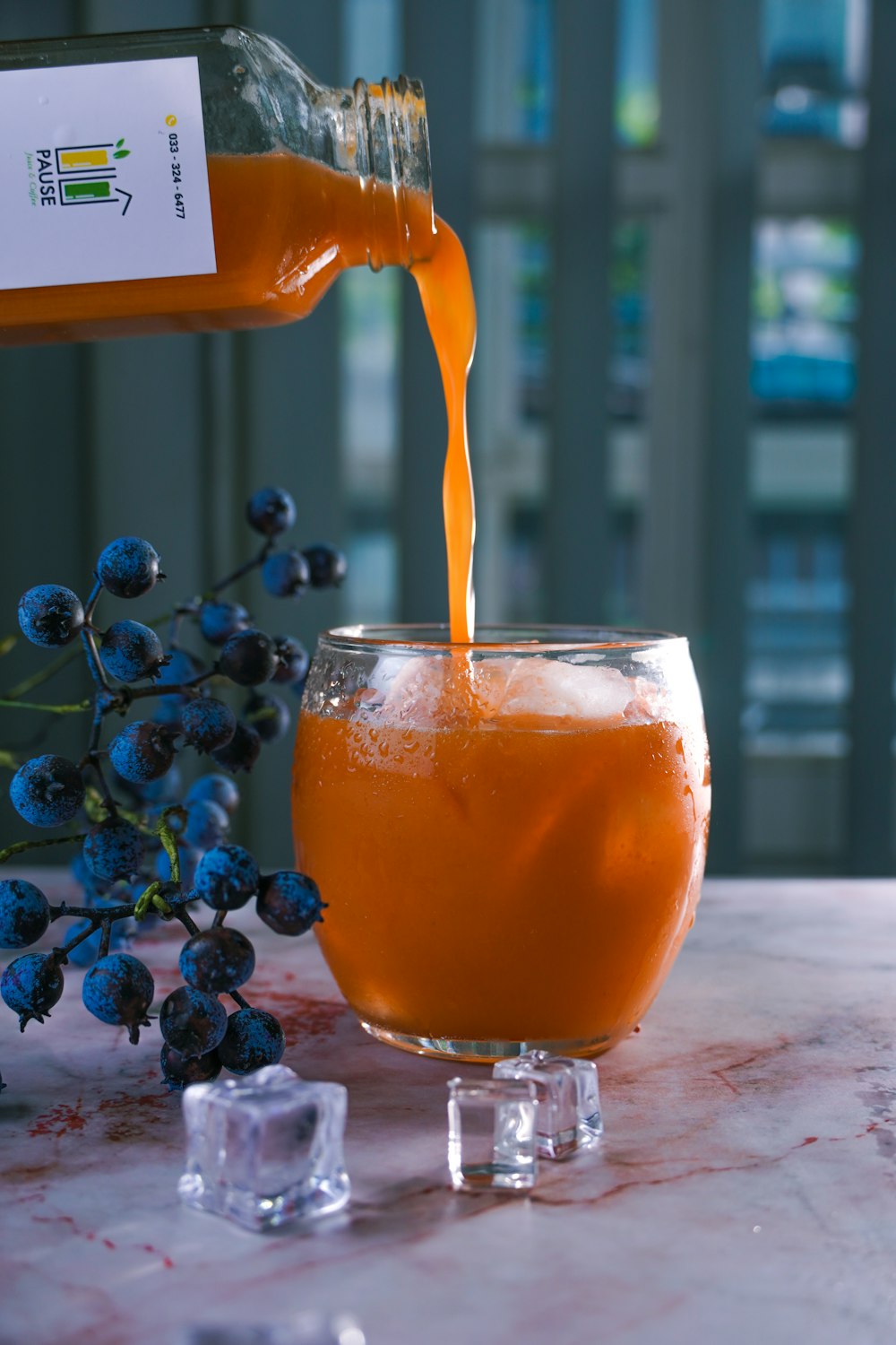 clear drinking glass with orange liquid