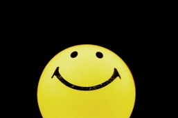 yellow and black smiley emoji