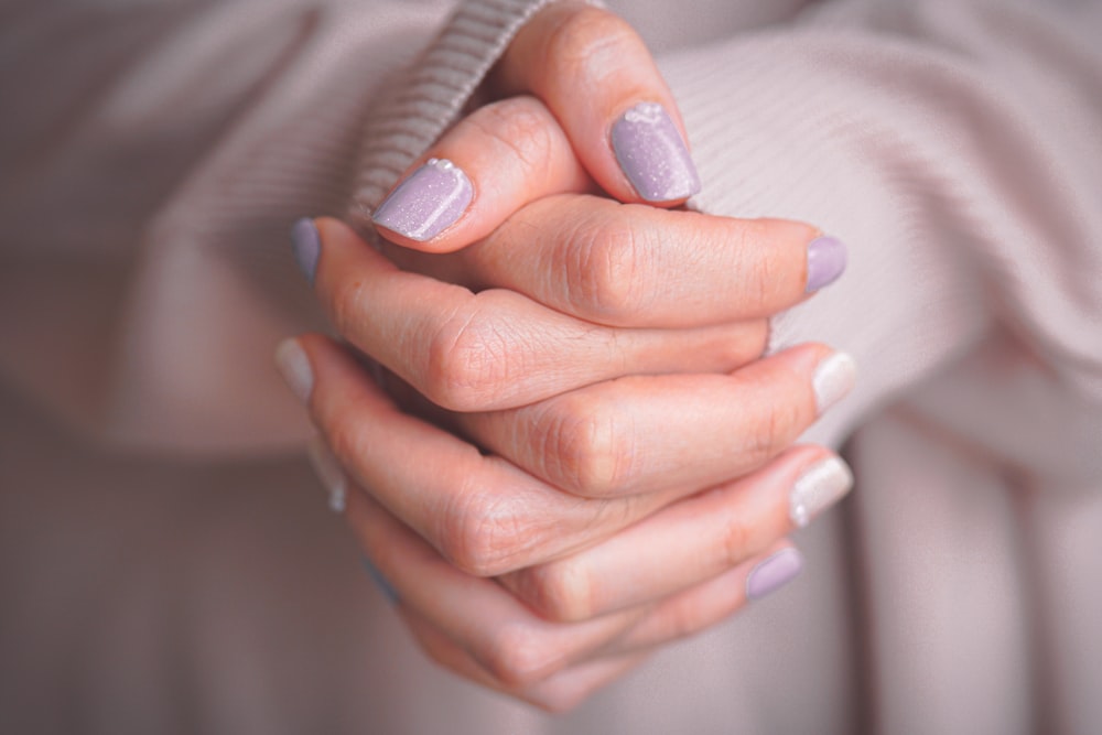 a woman's hands with a manicured manicure