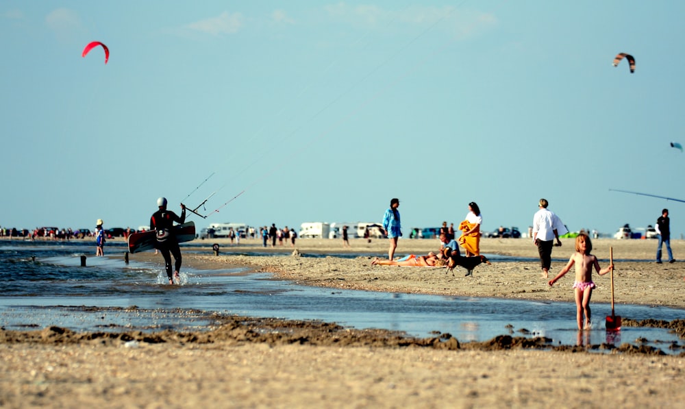 people playing basketball on beach during daytime