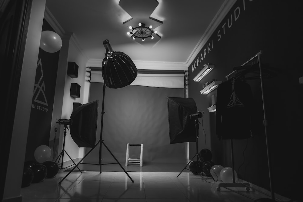 grayscale photo of music stand with drum kit