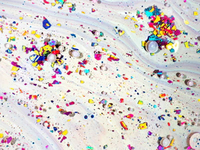 A glowing progress bar filling up with colorful particles floating around.