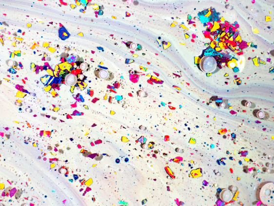 A vibrant animated background with swirling colors and subtle canned food illustrations reflecting freshness and anticipation.