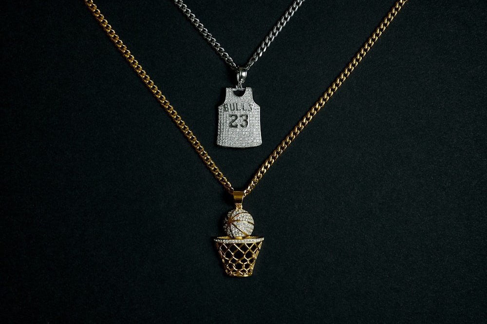 silver heart pendant necklace on black textile