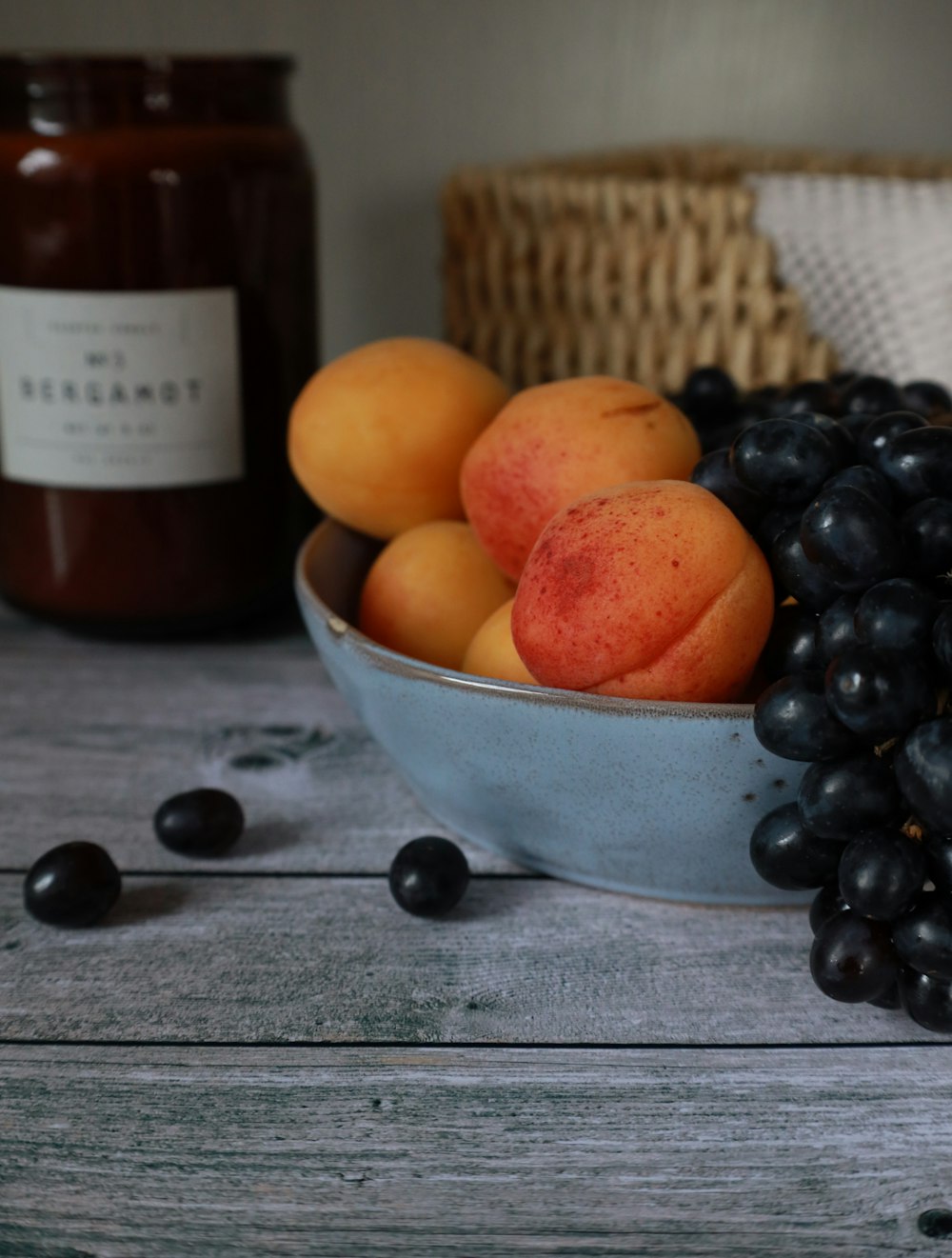 orange fruits in white ceramic bowl