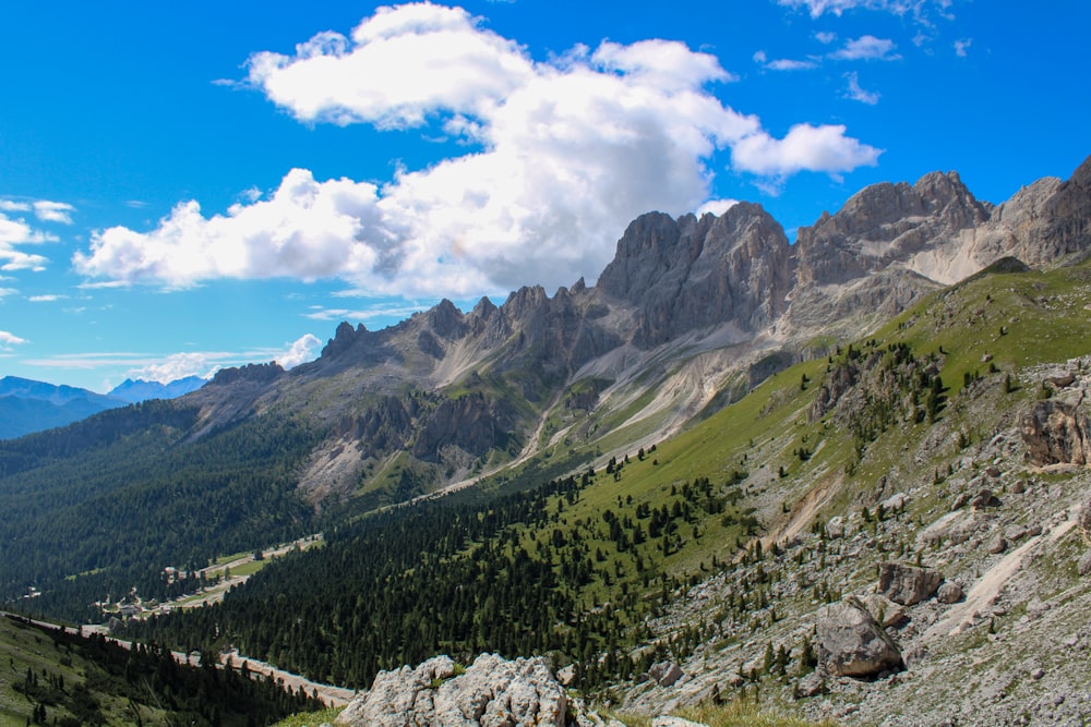 green and brown mountains under blue sky and white clouds during daytime