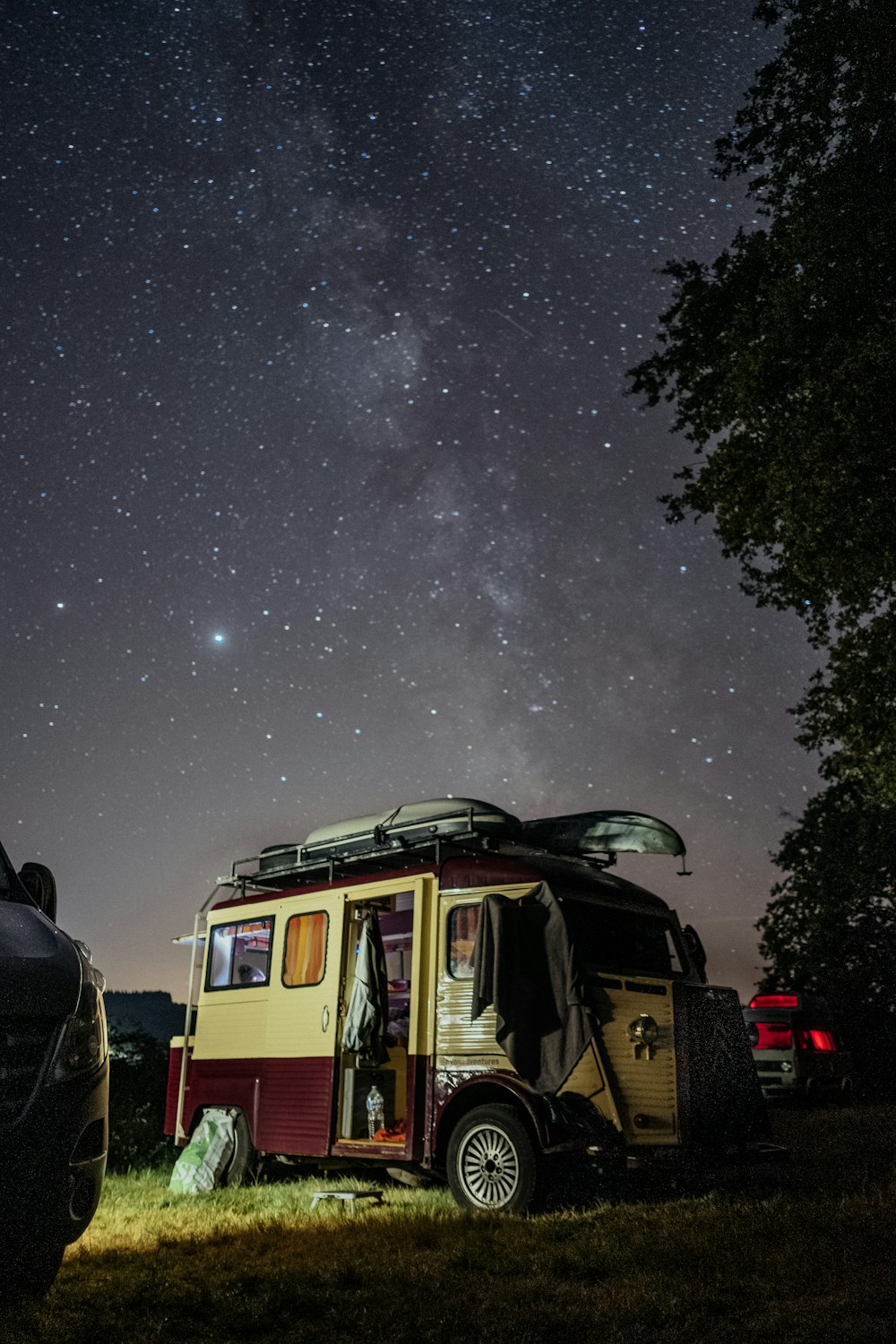 red and white bus under starry night