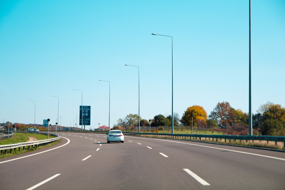 white car on road during daytime