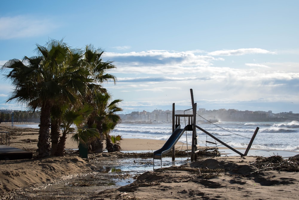 brown wooden ladder on beach shore during daytime