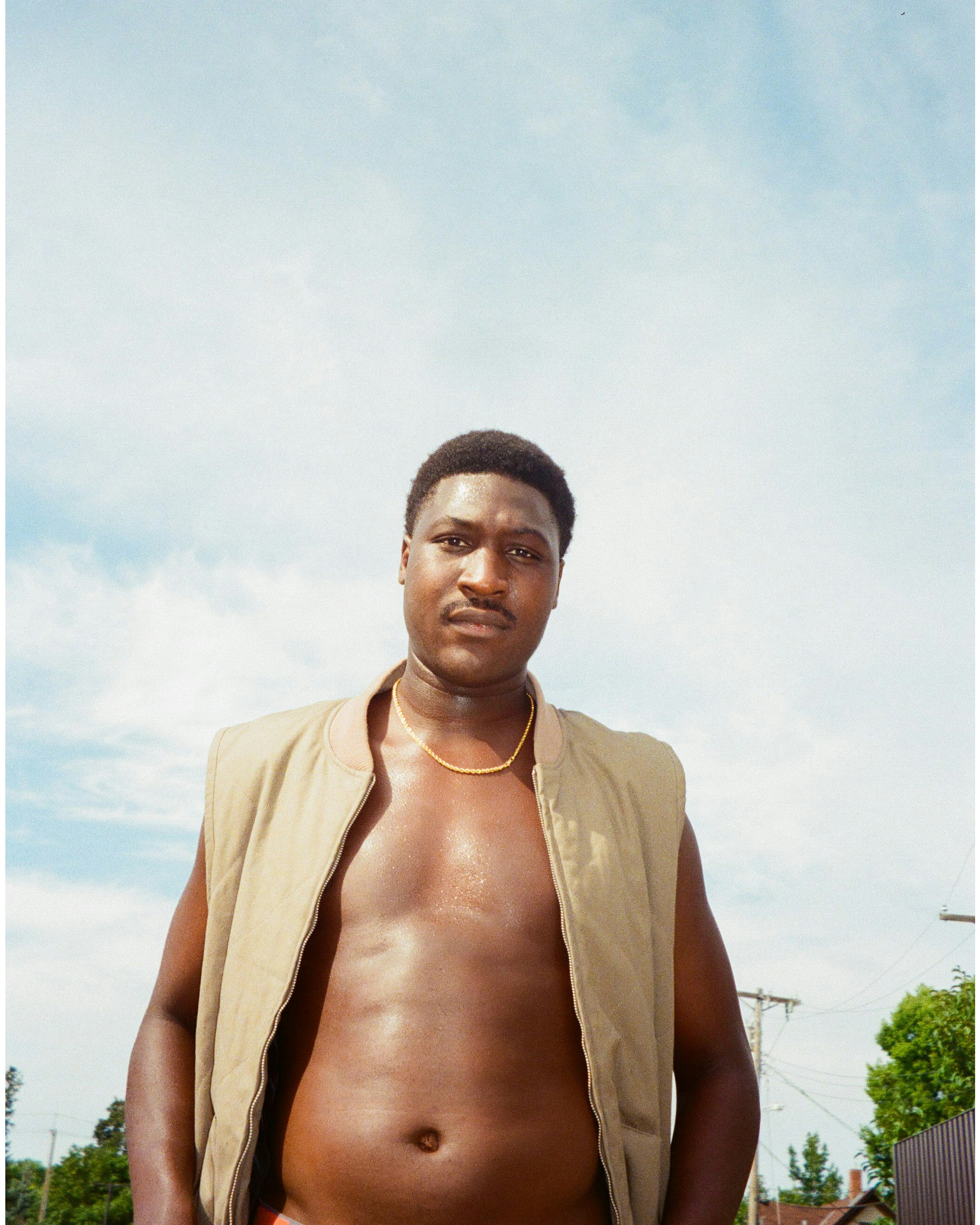 man in brown suit jacket