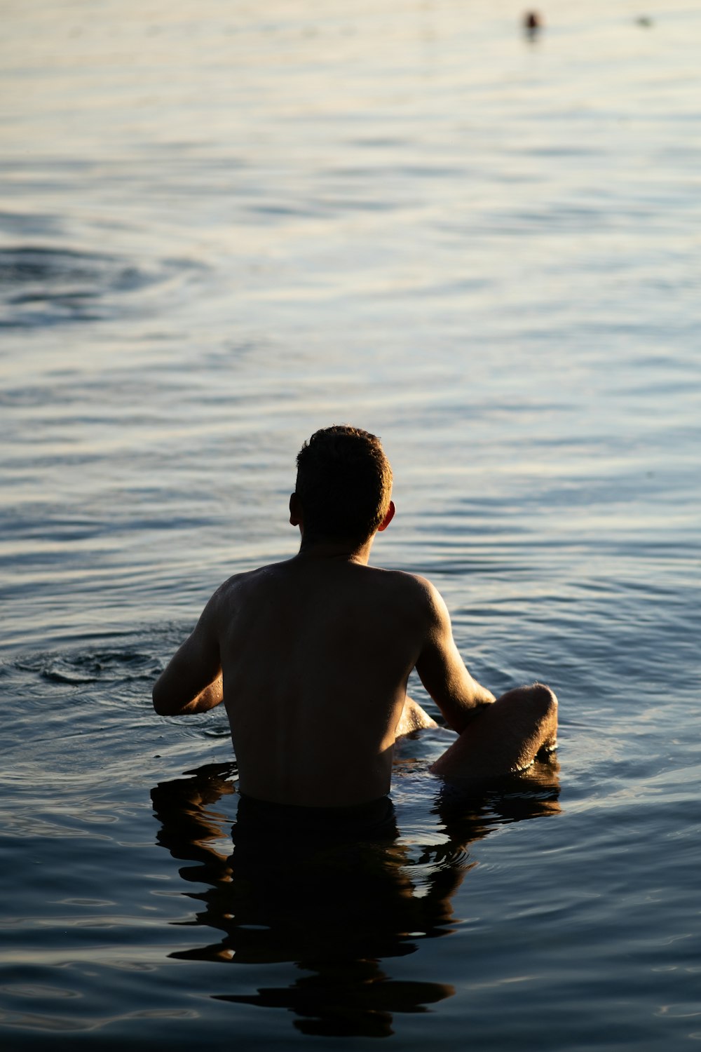 man in black shorts on water during daytime
