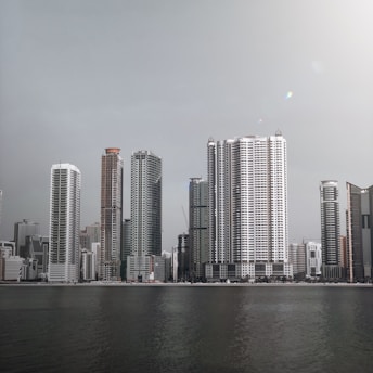 city skyline across body of water during daytime