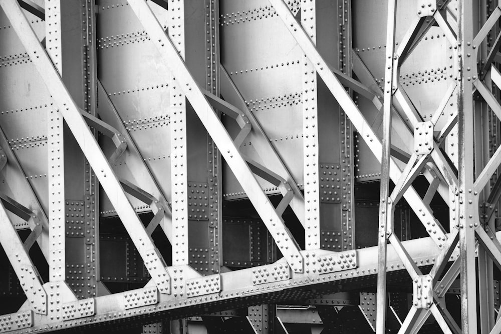 grayscale photo of metal bridge