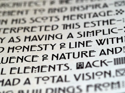 Close-up of a contemporary art event ticket with subtle grayscale patterns and clean typography.