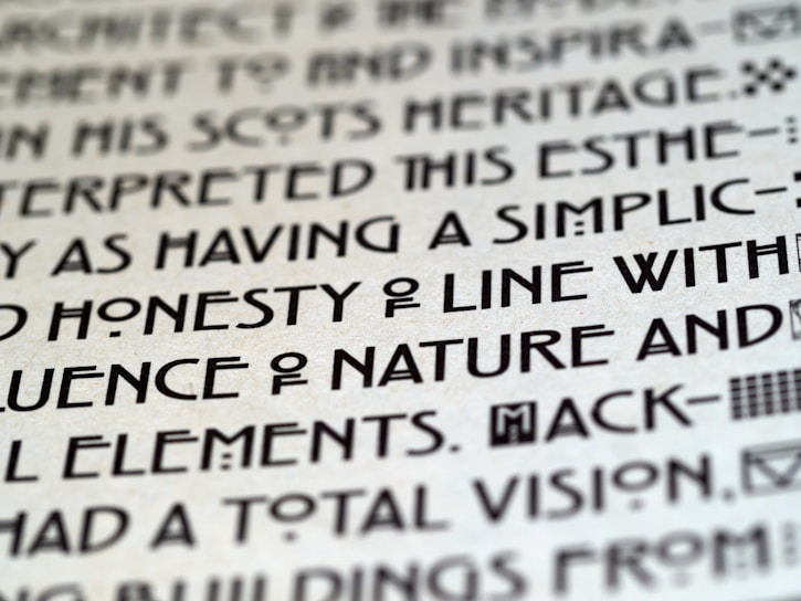 A close-up of a sleek, modern typeface sample displayed on a clean white background.