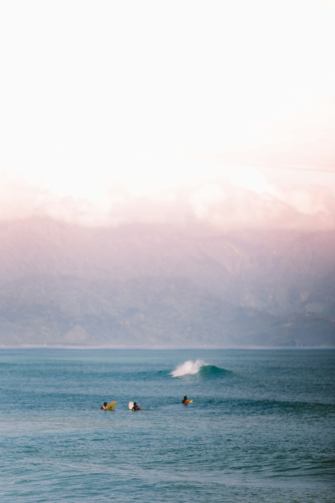 people surfing on sea during daytime