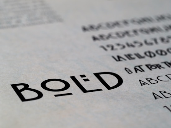 Text featuring the word 'BOLD' in a clear, sans-serif font. Surrounding the main focus are additional alphabet characters and numbers, suggesting a typographic or design context.