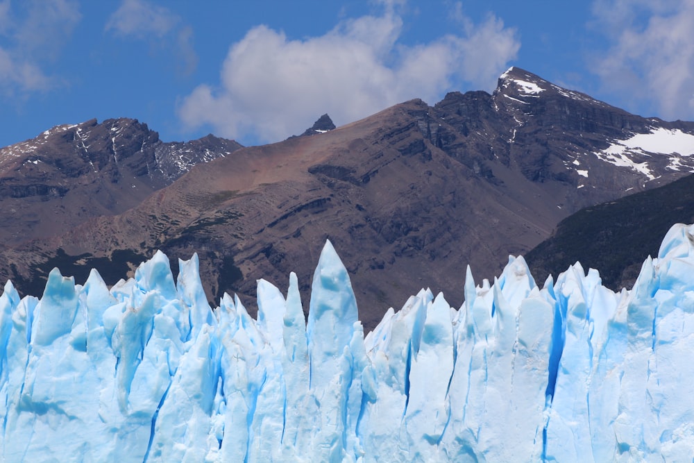 brown rocky mountain under blue sky during daytime