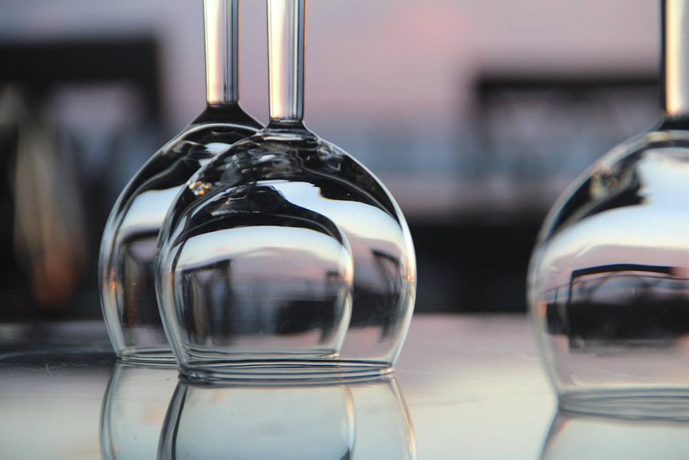 clear glass bottle on white table