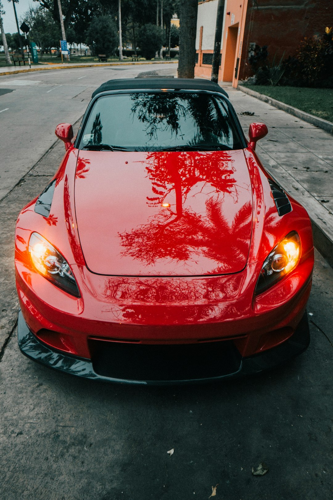 red ferrari car on road during daytime