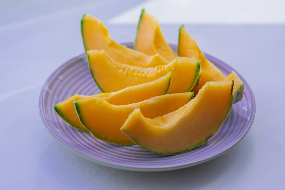 sliced fruit on white ceramic plate