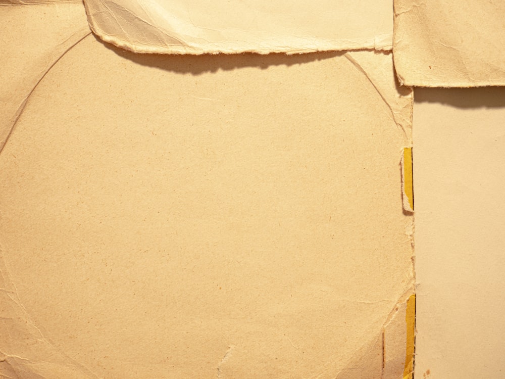 white textile on brown cardboard box