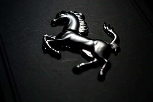 Golden lion emblem shining against a sleek black background with modern red accents.