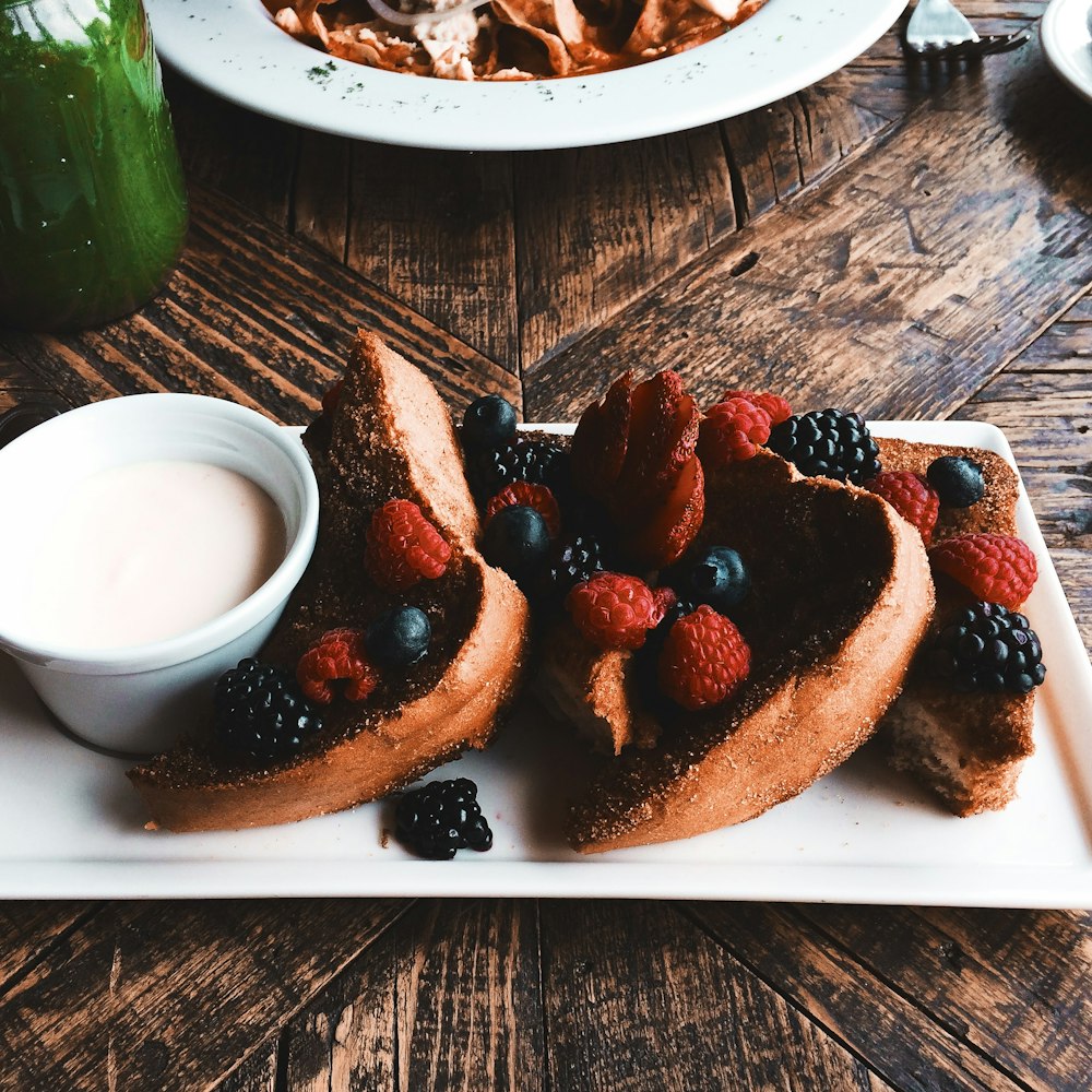 sliced bread with strawberry on white ceramic plate