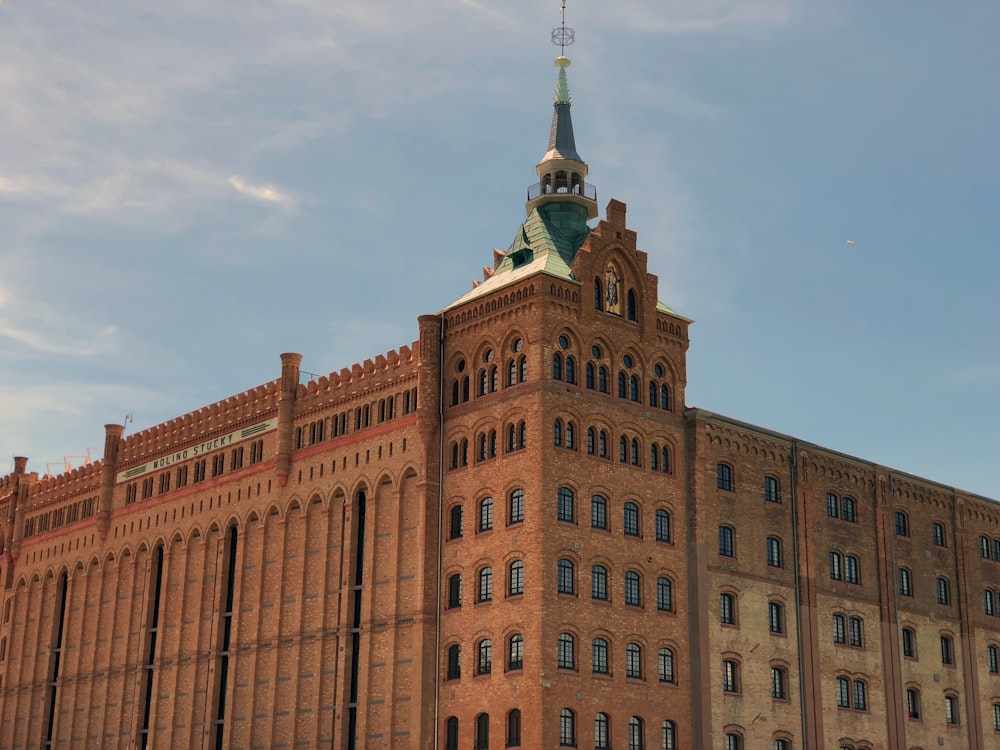 brown concrete building under blue sky during daytime