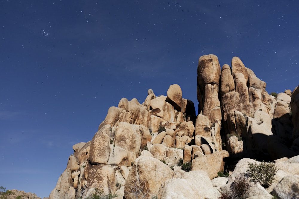 brown rock formation under blue sky during daytime