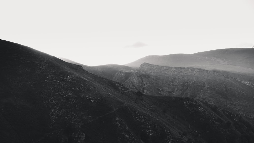 gray and black mountains under white sky during daytime