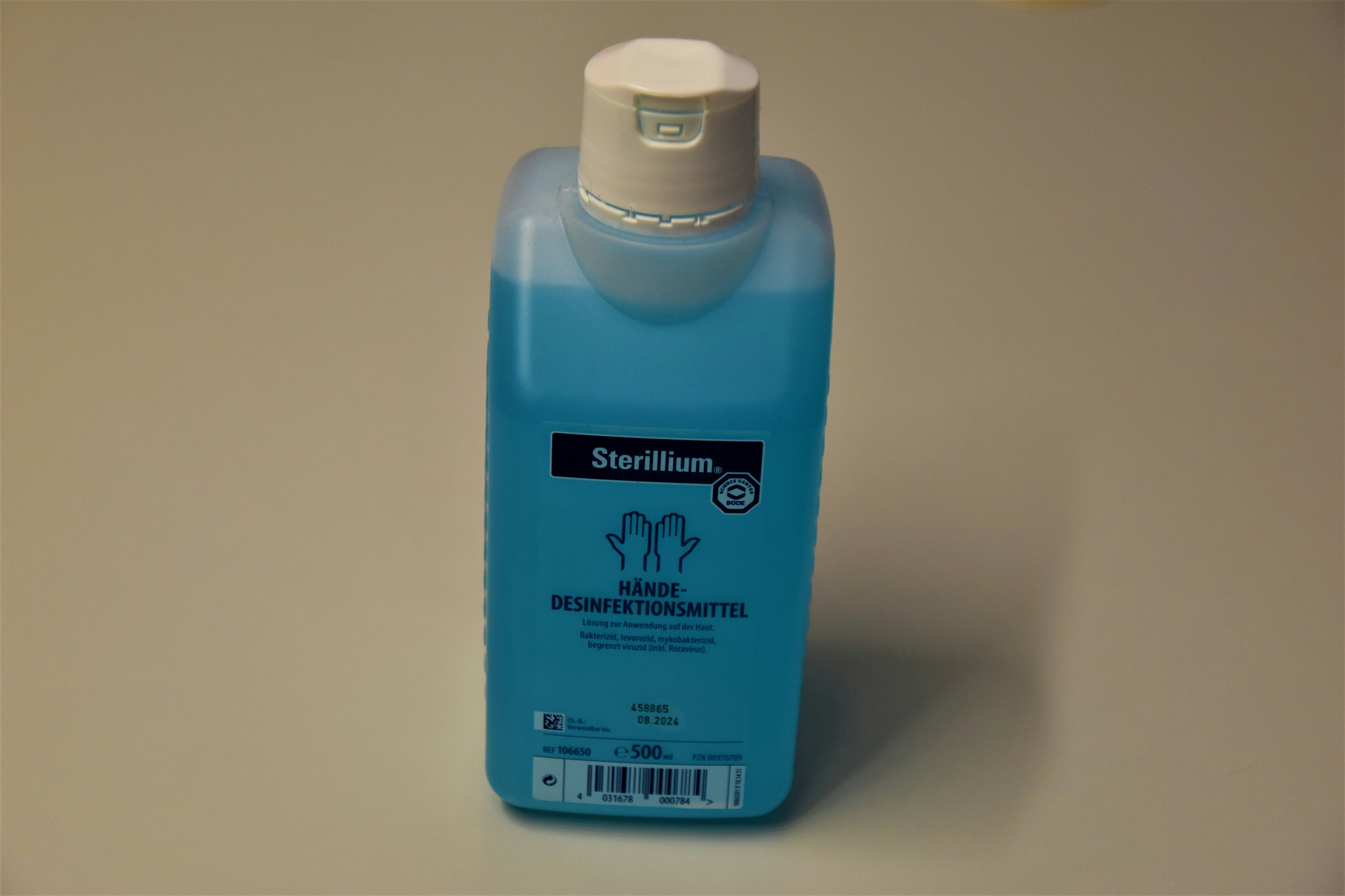 blue plastic bottle on white table