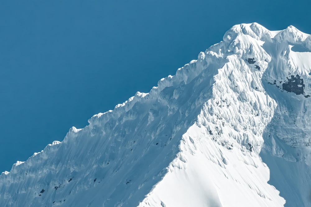 snow covered mountain under blue sky during daytime