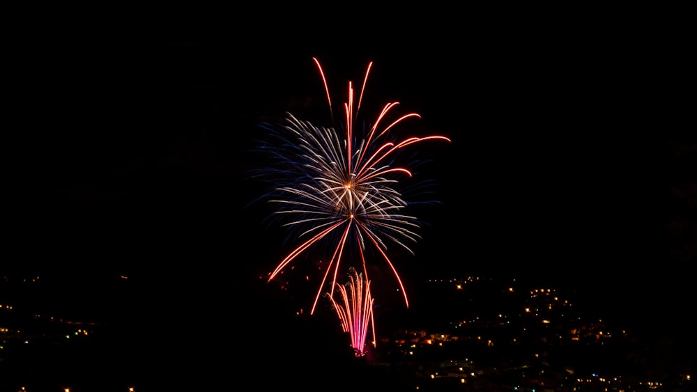 red and yellow fireworks display during nighttime