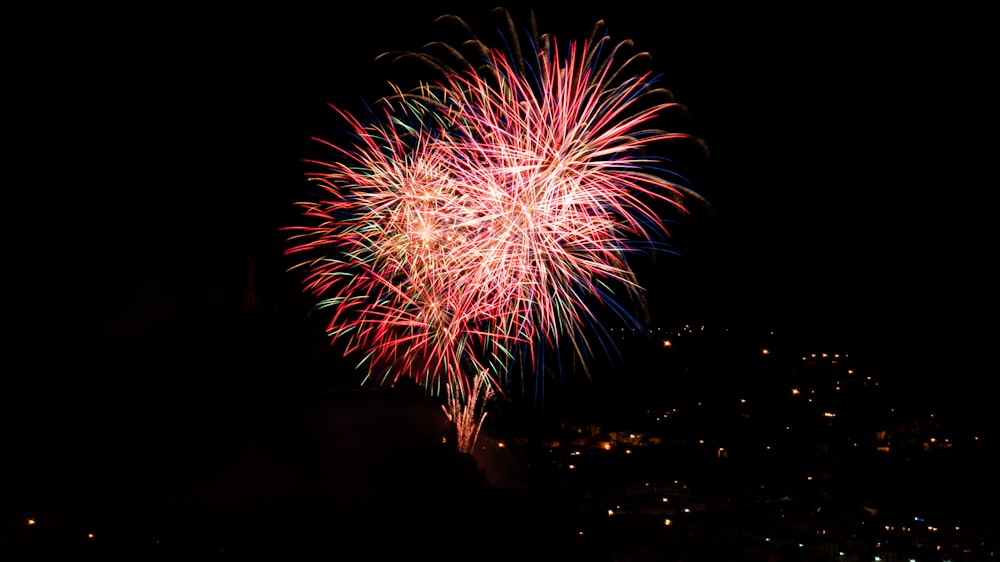 red and white fireworks display during night time