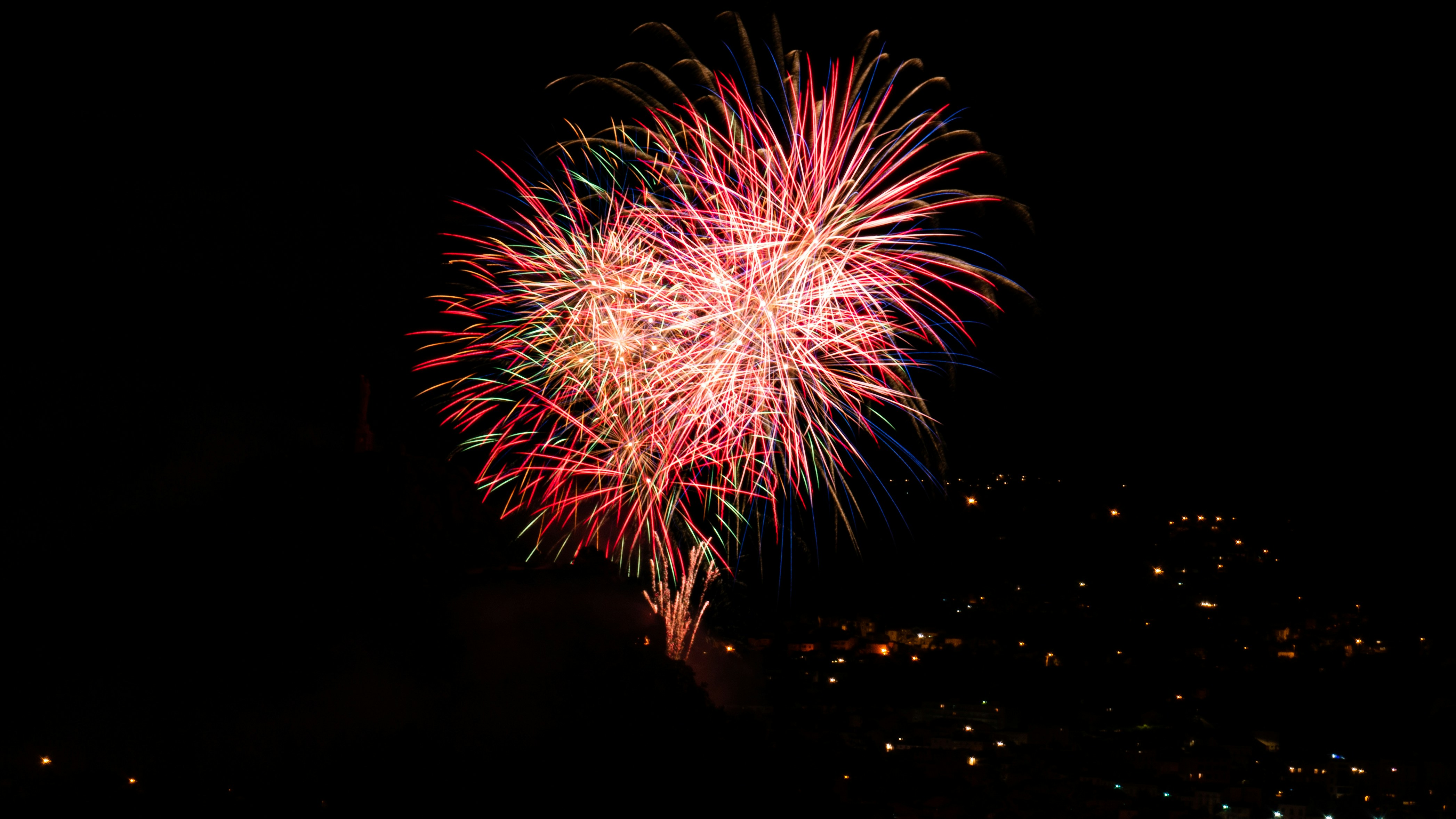 red and white fireworks display during night time