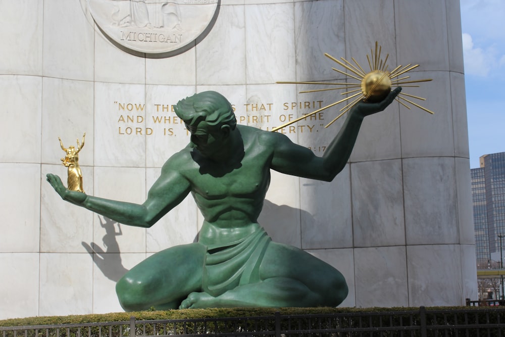 green statue of a man