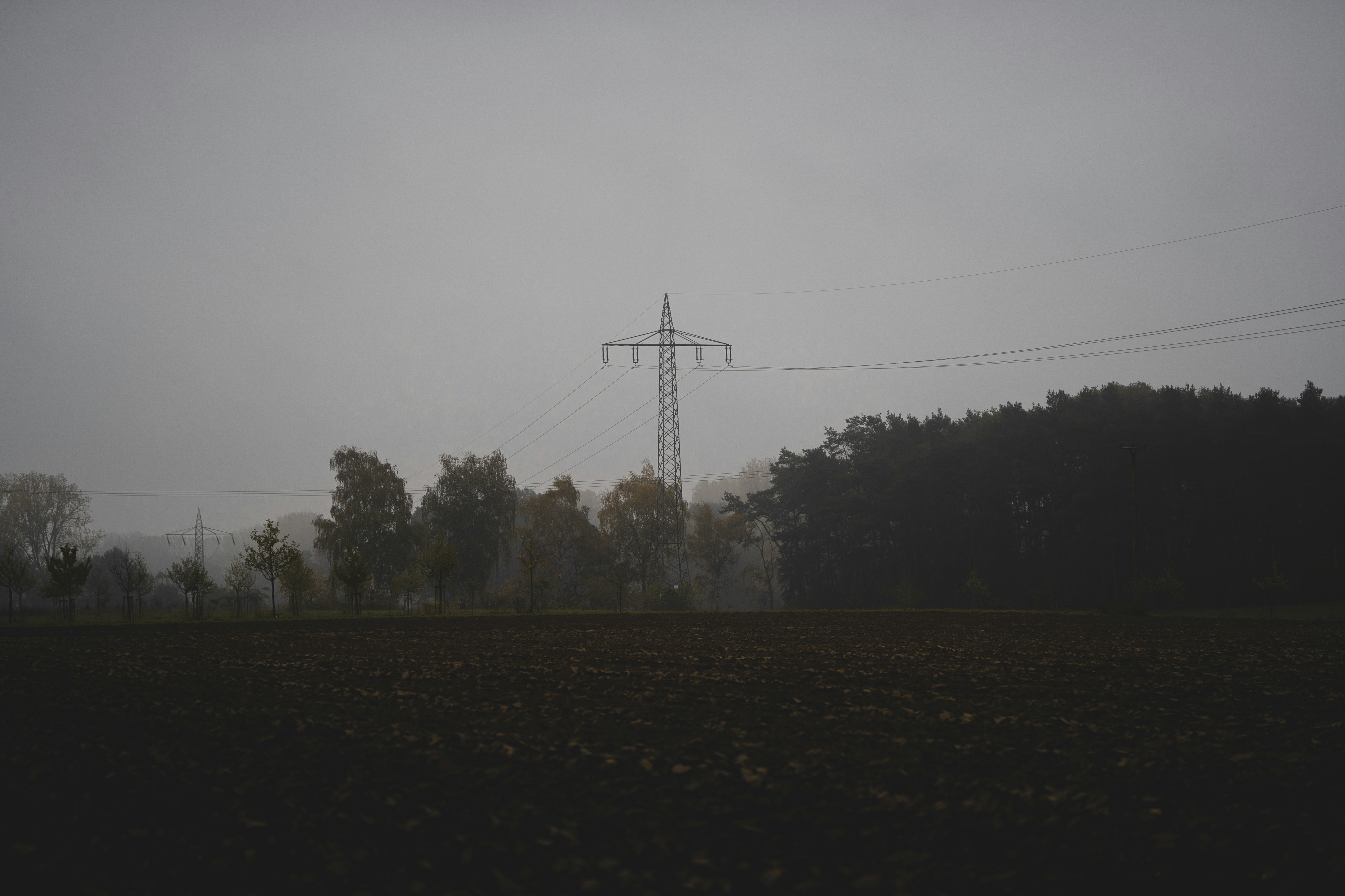 gray electric tower under gray sky