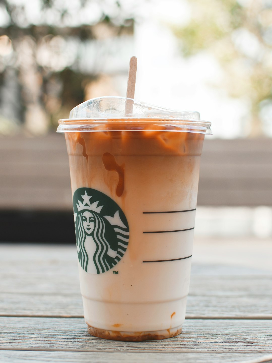 white starbucks disposable cup with straw