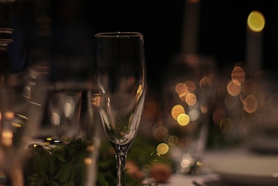 Close-up of sparkling wine glasses catching the light on a festive table.