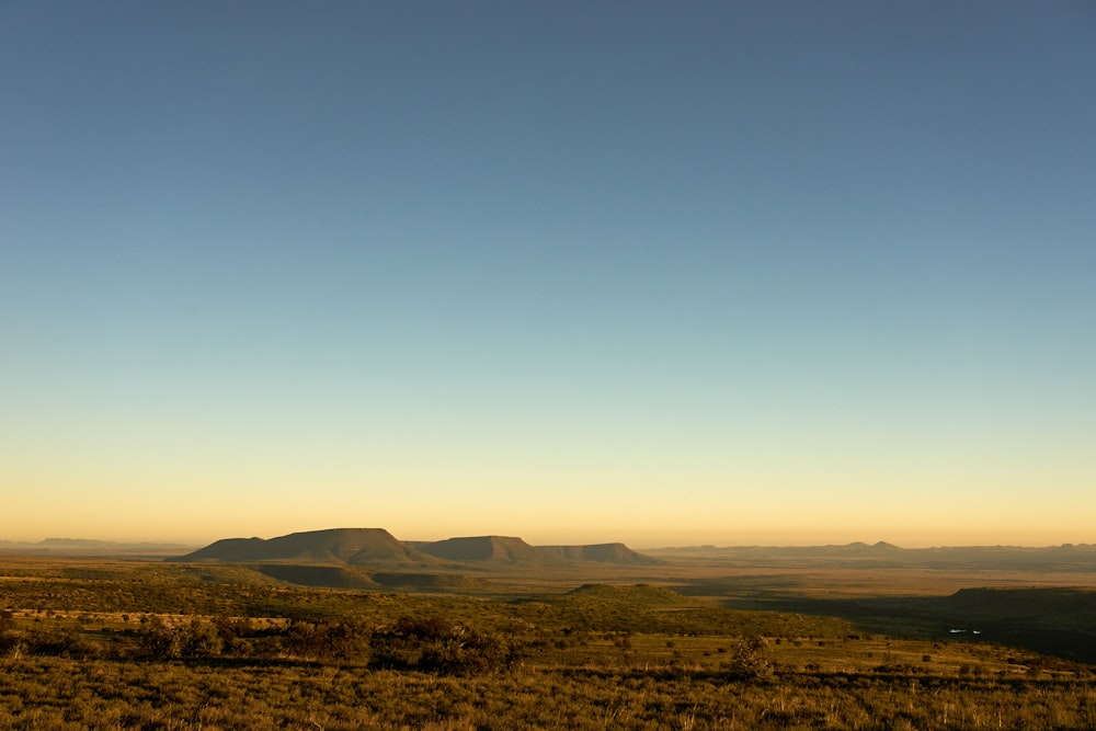 brown mountains under blue sky during daytime