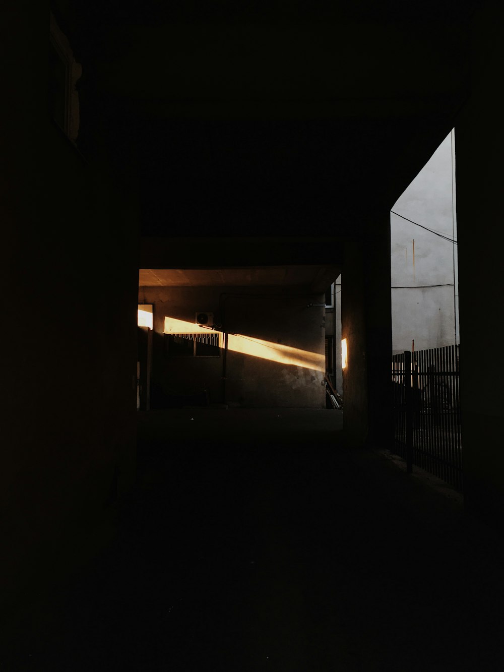 white wooden door in dark room