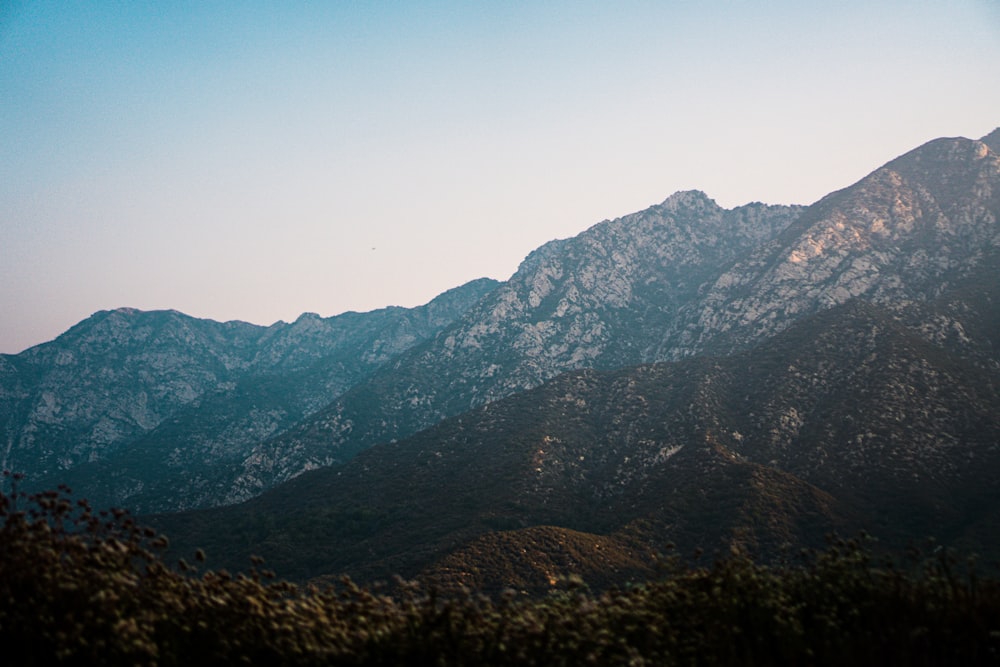 green and brown mountains under blue sky during daytime