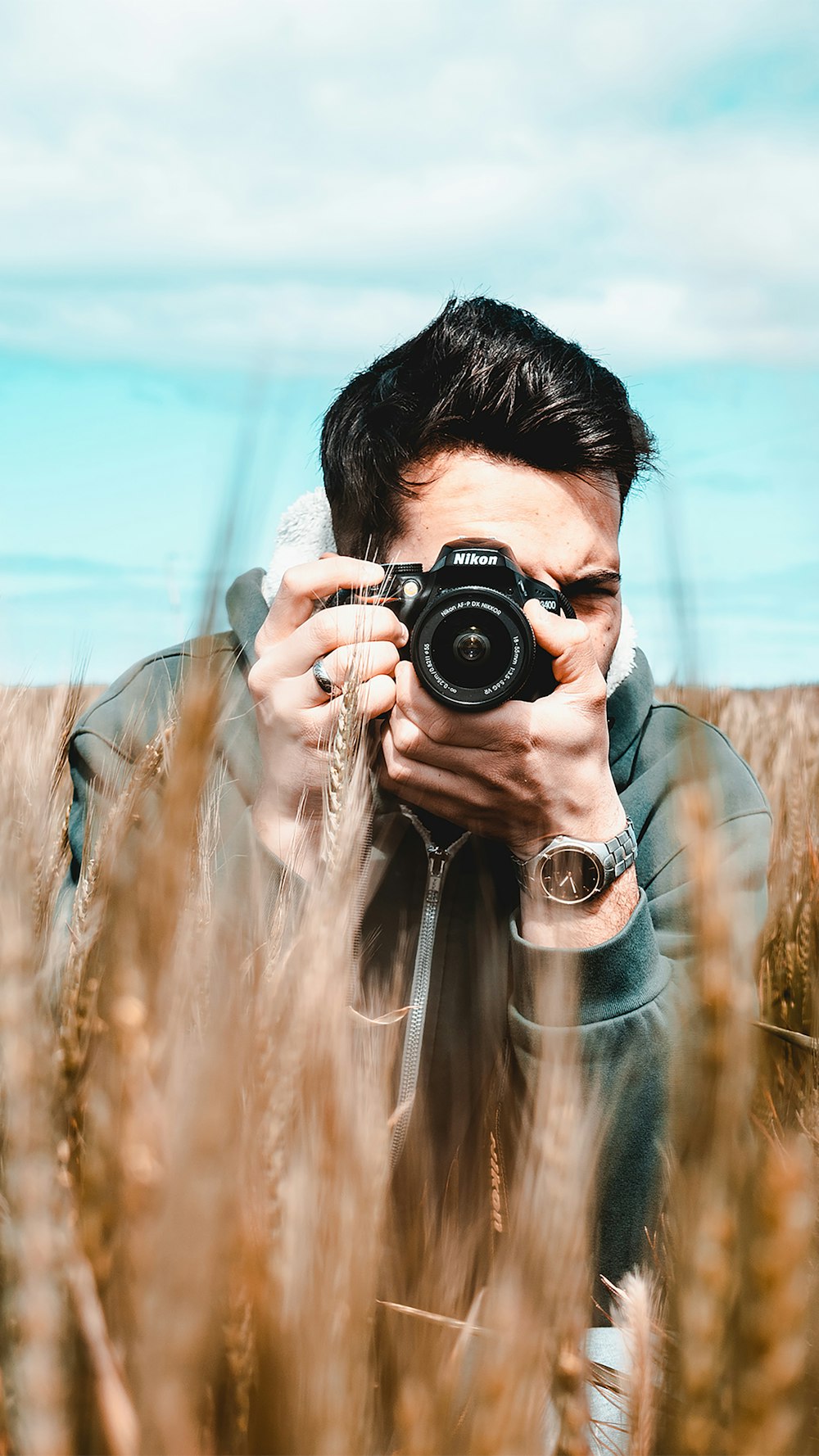 woman holding black dslr camera