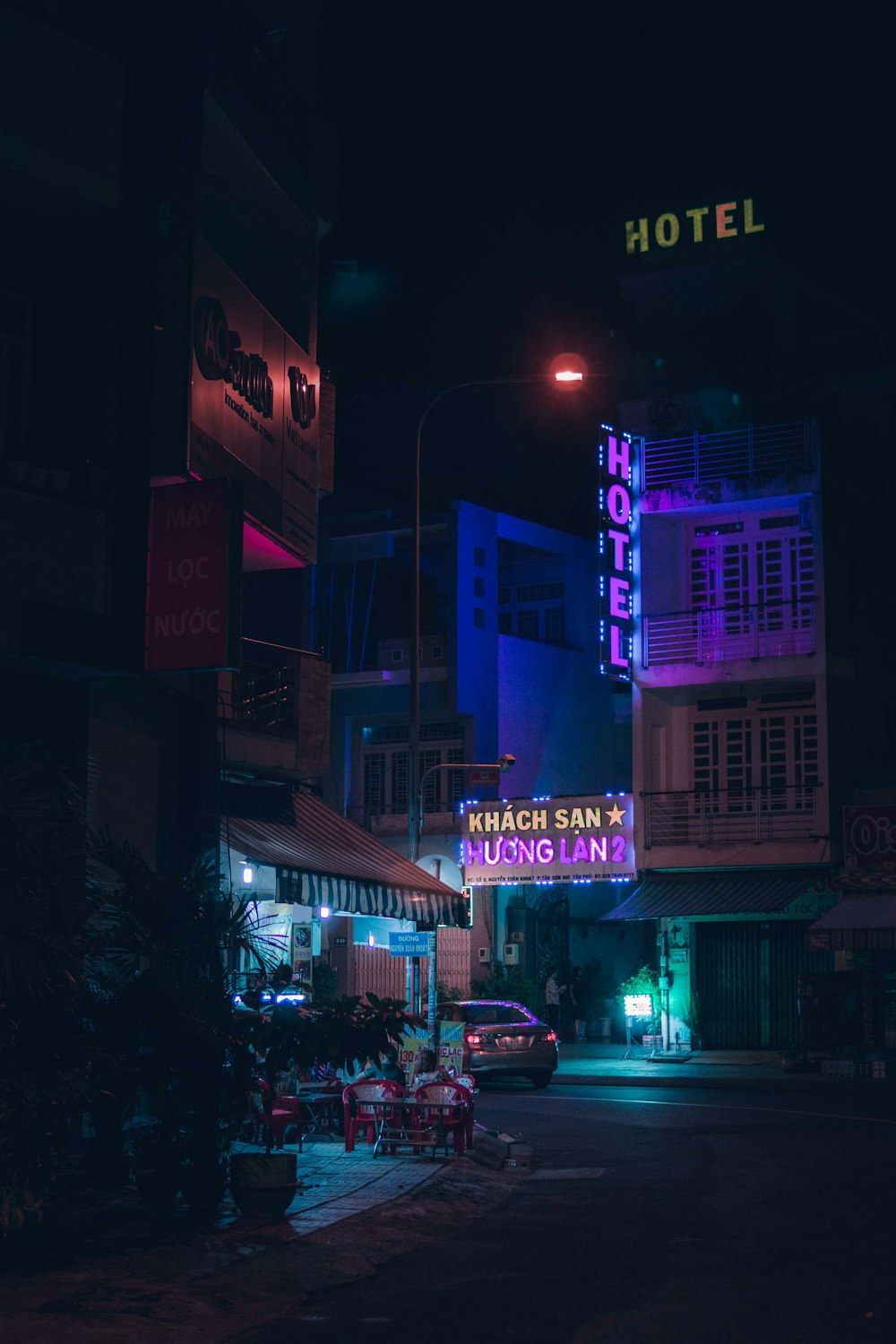 cars parked in front of store during night time