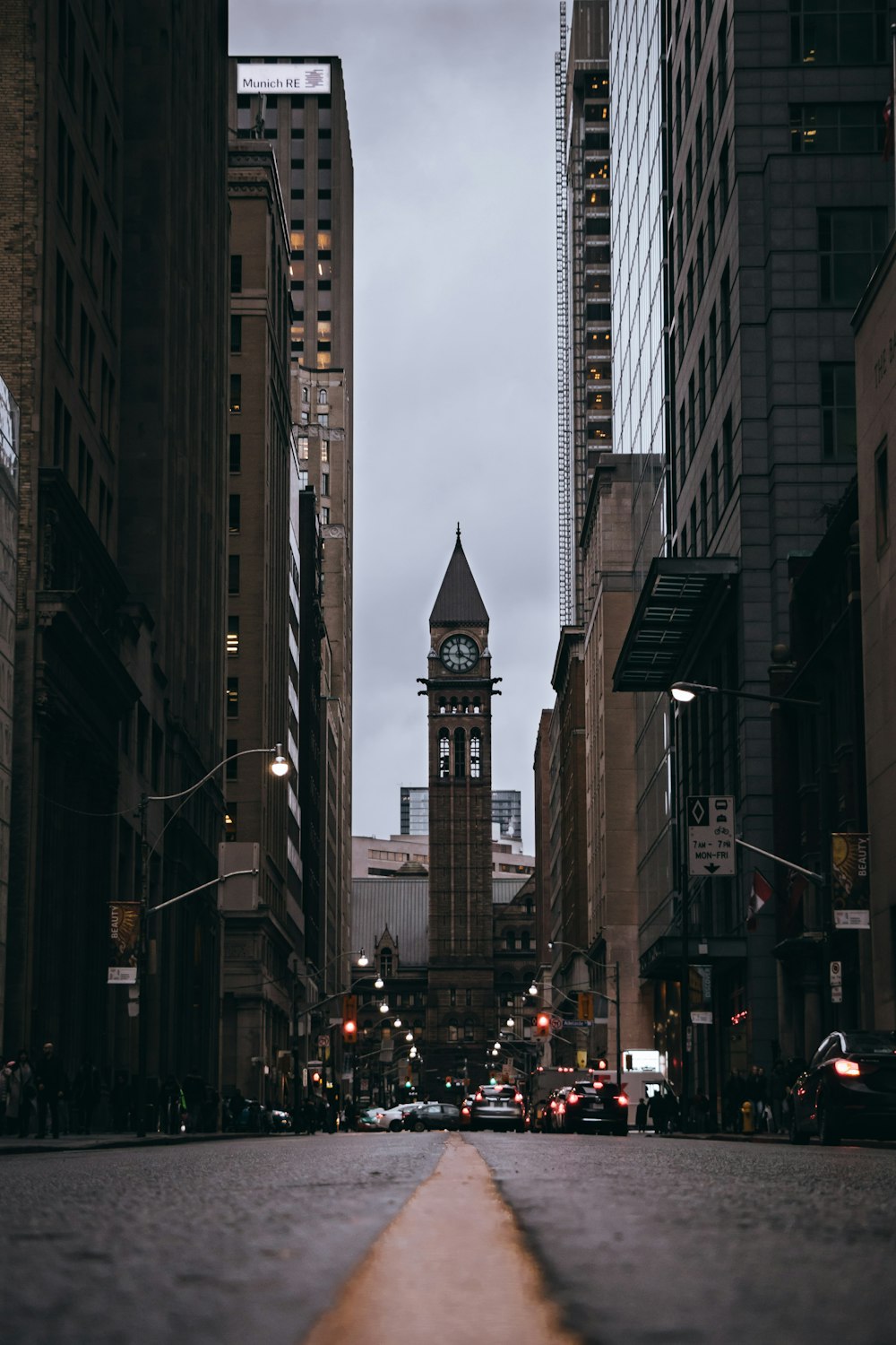 people walking on street near high rise buildings during daytime