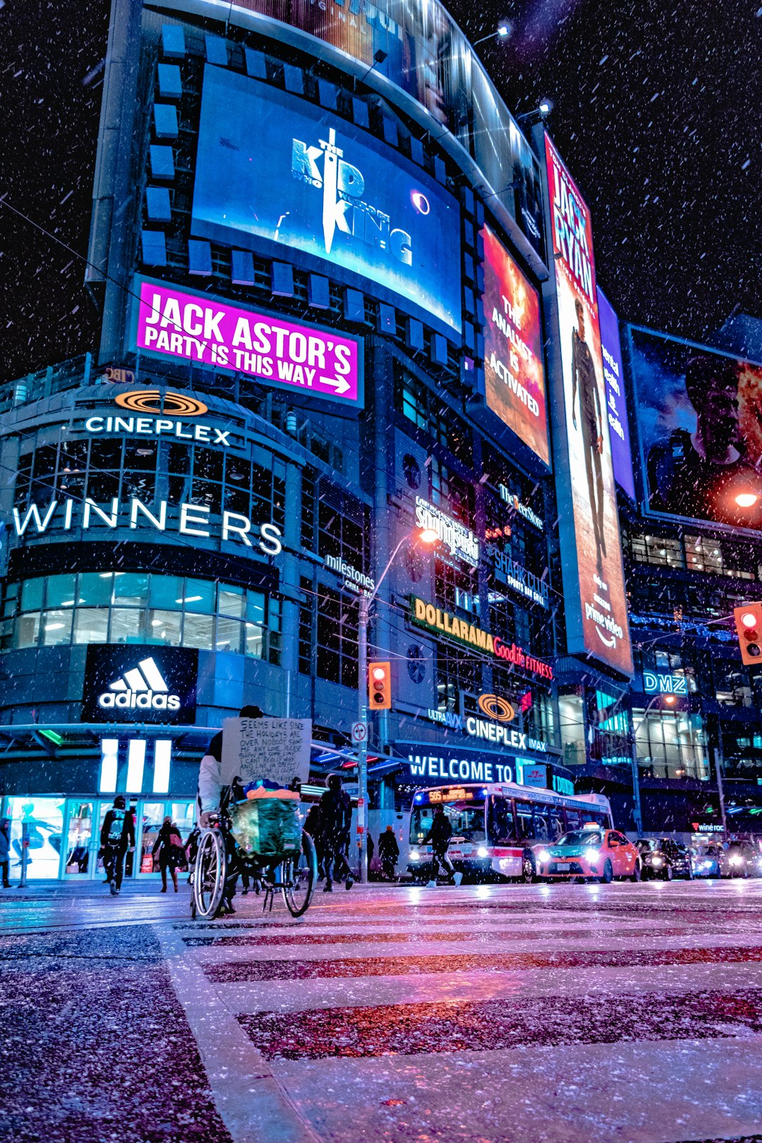 people walking on street during night time