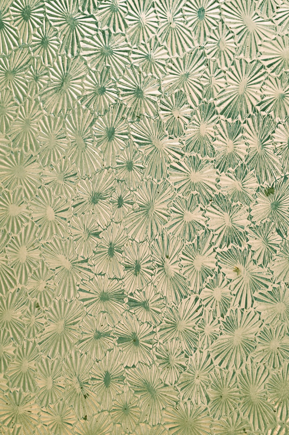 green and white floral textile